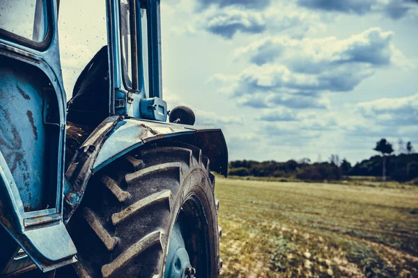 Old tractor in the field, beautiful view