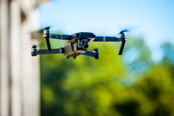 Drone quadcopter with digital camera. Against the sky