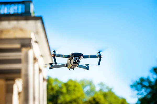 Drone quadcopter with digital camera. Against the sky