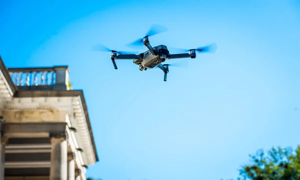 Drone quadcopter with digital camera. Against the sky