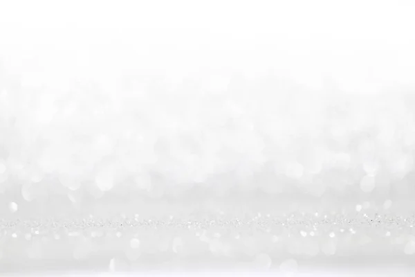 抽象的なシルバーに光るデフォーカス キラキラの背景 — ストック写真