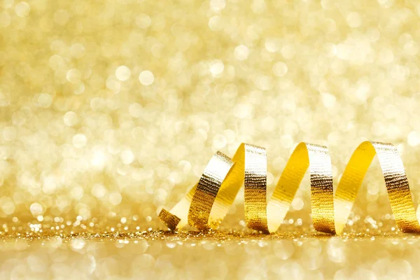 Golden Curly Ribbon Decoration Glitter Background Close — Stock Photo, Image