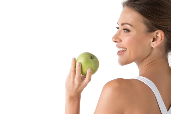 Kvinna med innehav av grönt äpple — Stockfoto