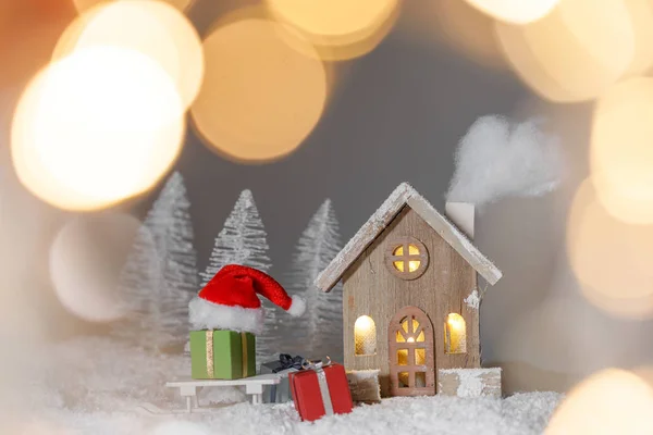 Biglietto natalizio con casa sulla neve — Foto Stock