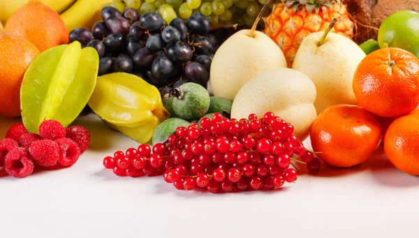 Fresh fruits pile on white — Stock Photo, Image