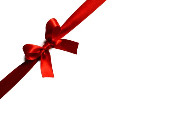 Red gift bow on white — Stock Photo, Image
