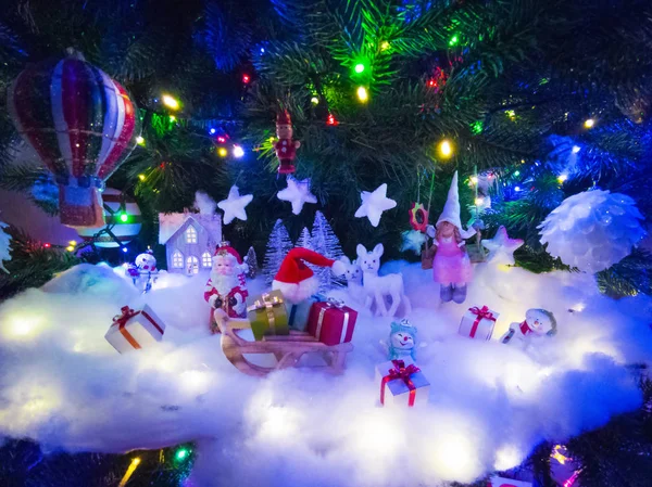Christmas decor under the tree — Stock Photo, Image