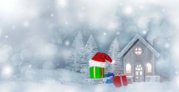 Kerstkaart met huis in de sneeuw — Stockfoto