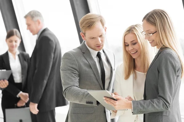 Three Smart Employees Discussing Documents Using Tablet Meeting — Stock Photo, Image