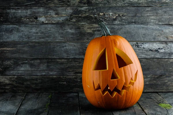 Χαραγμένη Κολοκύθα Αποκριών Jack Lantern Ξύλινο Φόντο — Φωτογραφία Αρχείου