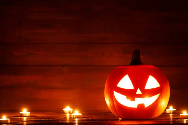 Halloween Jack Lantern Pumpa Huvud Och Bränna Ljus Trä Bakgrund — Stockfoto