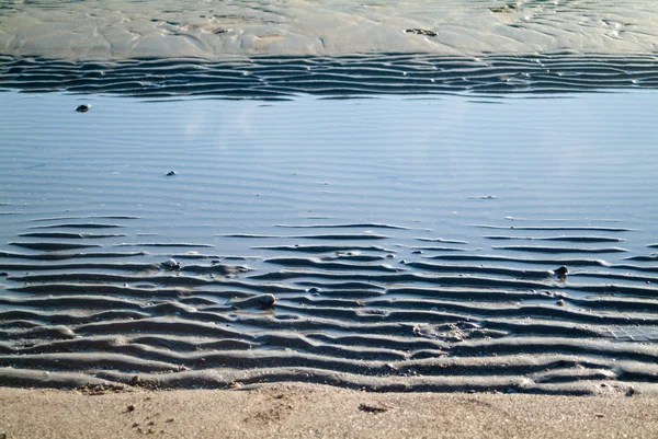 Regular shaped on the beach sand — Stock Photo, Image