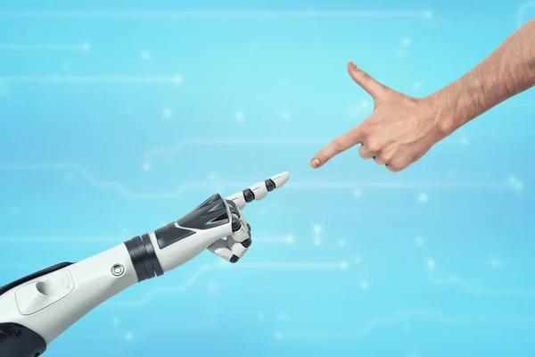 Una mano umana e una mano robotica che si allungano l'una verso l'altra puntando il dito indice . — Foto Stock