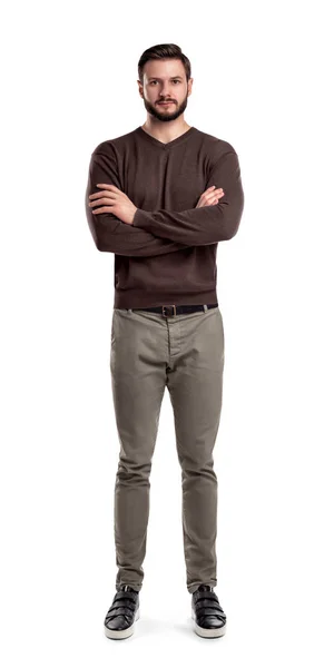 A bearded man in casual garb stands in front view with folded arms and neutral face expression. — Stock Photo, Image