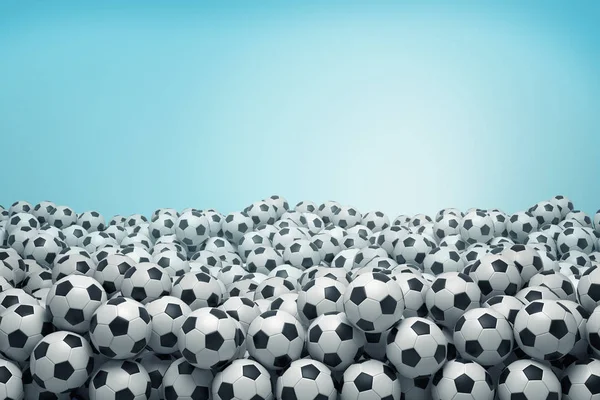 3d 渲染许多相同的黑白足球球躺在一个巨大的堆在一个蓝色的背景. — 图库照片