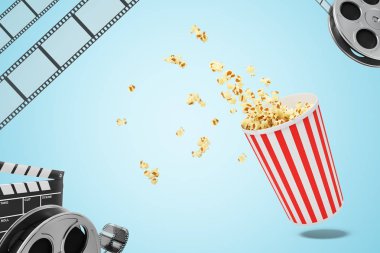 bir patlamış mısır kova patlamış mısır, film makaraları ve bluebackground üzerinde bir film tokmağı ile 3D renderinf