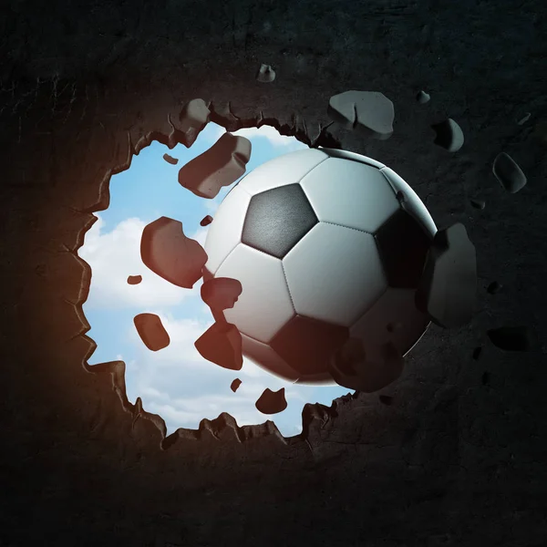 3d close-up rendering of a football punching a big round hole in the black wall with blue sky seen through the hole.