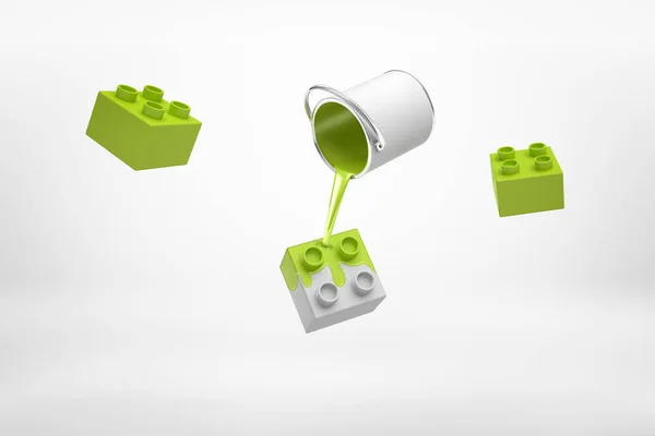 3d representación de pequeño cubo de pintura de plata al revés con pintura verde vertiendo sobre piezas de lego aisladas sobre fondo blanco — Foto de Stock