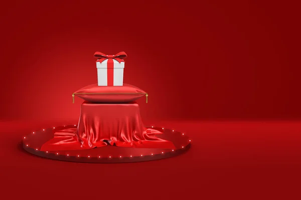 Renderingu 3D białe pudełko z czerwoną wstążką na czerwone poduszki i cokołu pokryte czerwonego sukna na czerwonym tle — Zdjęcie stockowe