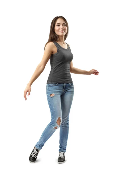 Молода брюнетка дівчина в повсякденних джинсах і футболці, що перетворюється ізольована на білому тлі — стокове фото
