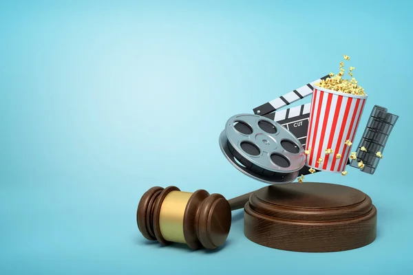 3d rendering of film reel, popcorn bucket, and clapperboard suspended in air above sound block with gavel beside on blue background with copy space.