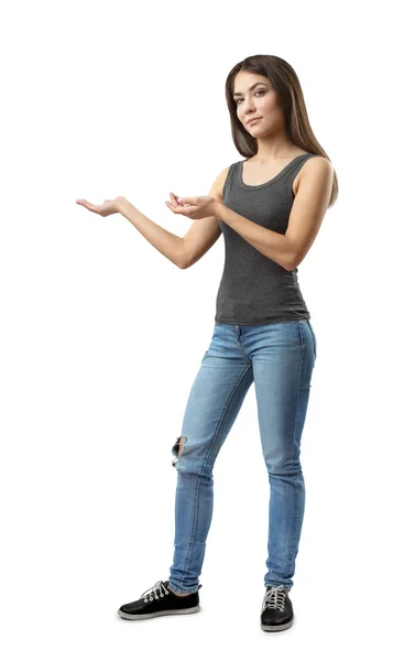 Jeune fille brune portant un jean décontracté et un t-shirt avec les paumes vers le haut isolé sur fond blanc — Photo