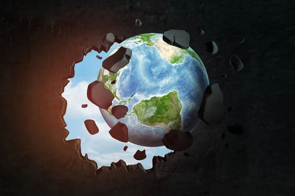 3d close-up rendering of planet Earth punching big hole in black wall with blue sky peeking though hole. — Stock Photo, Image