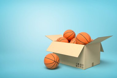 Mavi arka plan üzerinde karton kutu içinde basketbol 3d render.