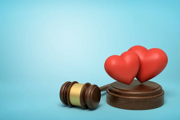 3D renderização de dois corações vermelhos bonitos no bloco de sondagem com martelo juiz ao lado no fundo azul claro com espaço de cópia . — Fotografia de Stock