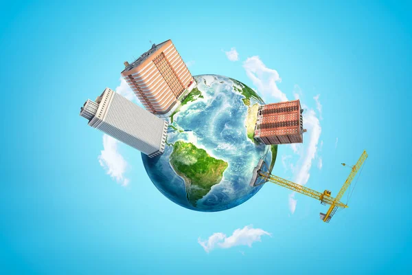 3d rendering of planet Earth in blue sky, with three super-huge blocks of flats and one hoisting crane on its surface. — Stock Photo, Image