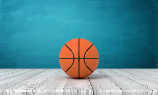 3D-Darstellung eines Basketballs auf hölzerner Oberfläche in der Nähe der blauen Wand. — Stockfoto