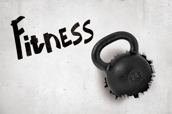 3d rendering of black kettlebell breaking white wall with Fitness sign on white background — Stock Photo, Image
