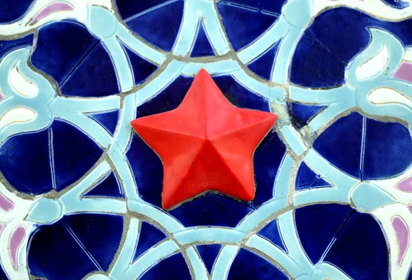 Macro photo of soviet decorative ornament with red star — Stock Photo, Image