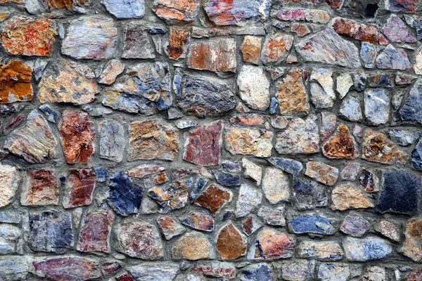 Makroaufnahme einer interessanten alten Steinmauer — Stockfoto