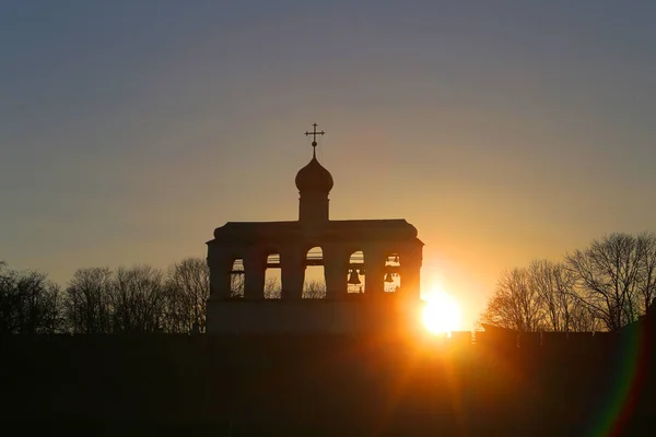 Photo of the bell tower at sunset in Veliky Novgorod — Stock Photo, Image