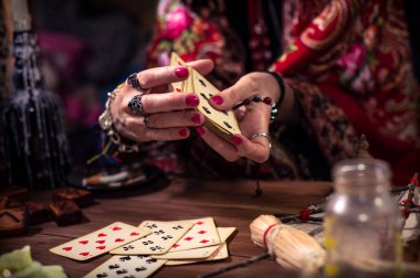 Gypsy fortune teller predicts the future with cards  clipart