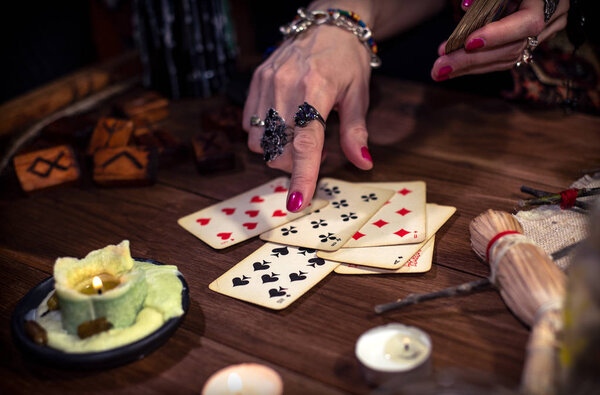 Gypsy fortune teller predicts the future with cards 