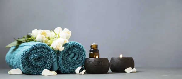 Spa Still Life Candles Towels Flowers Grey Background Copy Space — Stock Photo, Image