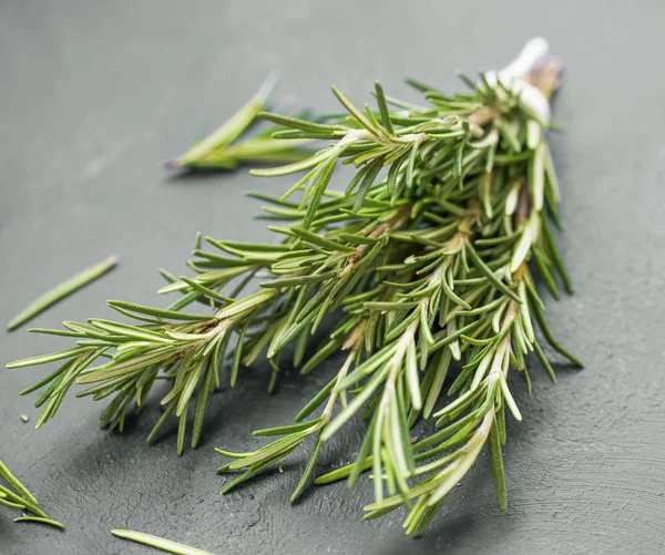 Fresh bunch of rosemary herb closeup, tasty aromatic herb kitchen condiment and ingredient , healthy aromatic herbs