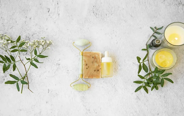 Natural organic skincare products on concrete background, top vi