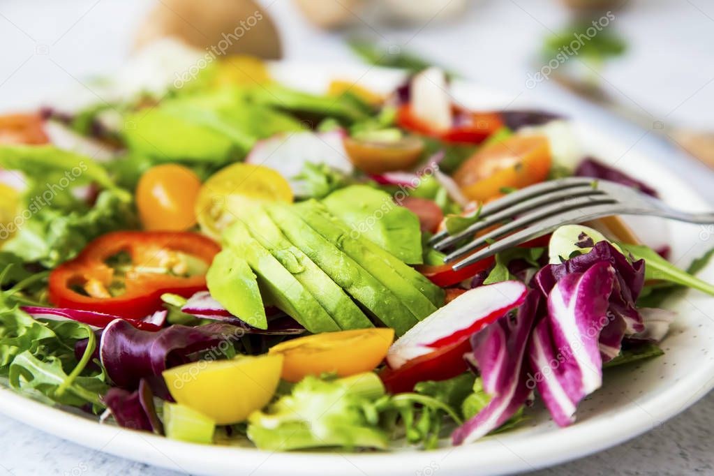 Healthy salad with bio organic vegetables, green vegan meal with
