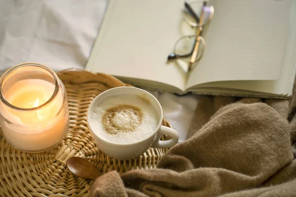 Cozy coffee cup, candle and soft cardigan, winter and autumn sti — Stock Photo, Image