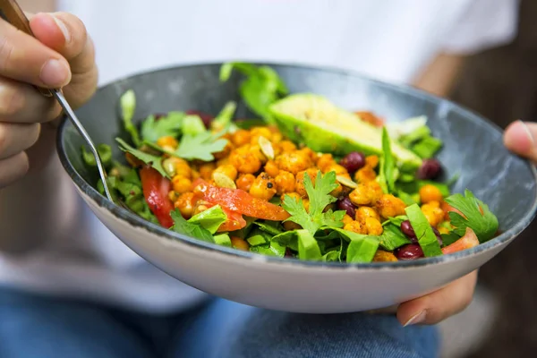 Clean eating, vegan healthy salad bowl closeup , woman holding s
