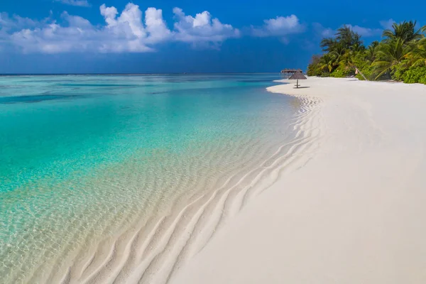 Tropical beach for vacation and holiday destination. Summer mood on tropical landscape. Beach nature, blue sea, blue sky and white sand. Amazing beach scene