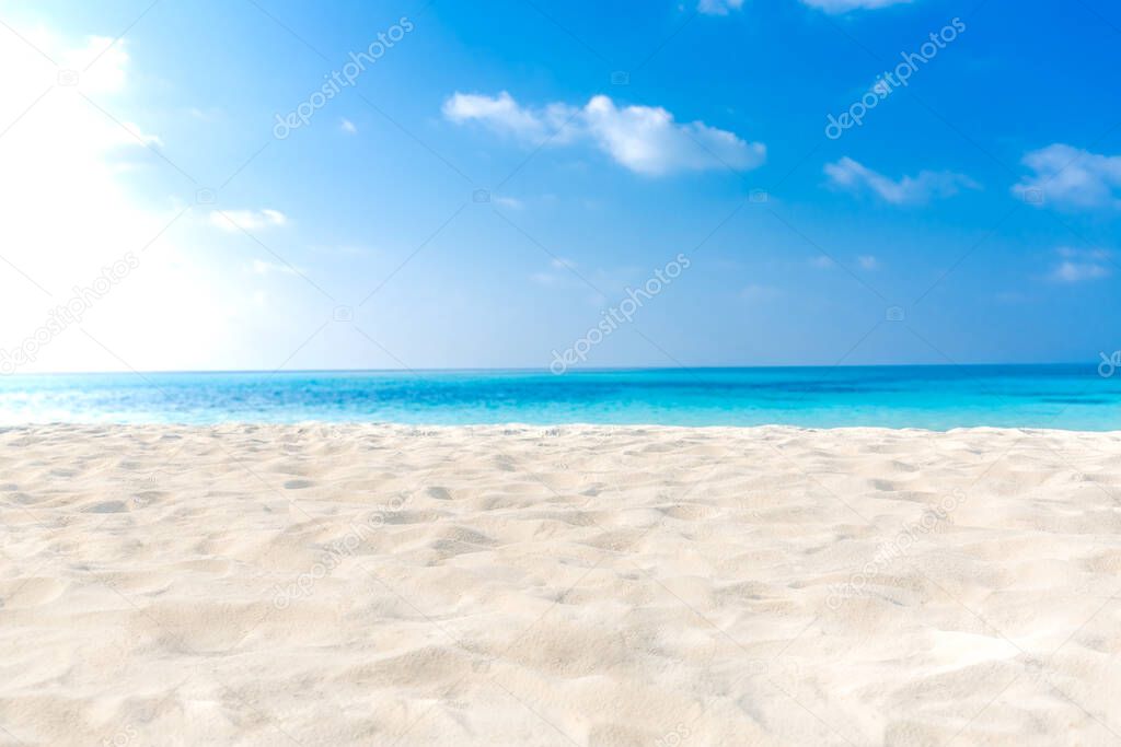 Beautiful beach with white sand, turquoise ocean water and blue sky with clouds in sunny day. Panoramic view. Natural background for summer vacation.