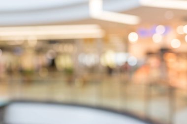 Soyut bulanıklık ve Bokeh güzel lüks alışveriş merkezleri ve arka plan için mağaza içi. Bulanık alışveriş merkezi, yürüyen insanlar.