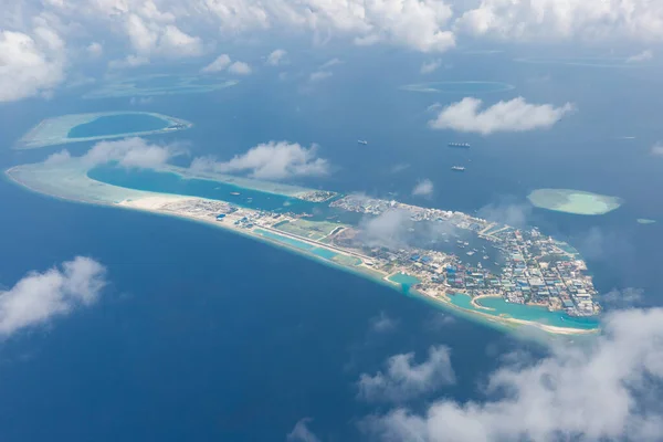 Aerial view on Maldives island. Tropical islands and atolls in Maldives from aerial view. Maldives coast of many islands and atolls which are the world top beauty.