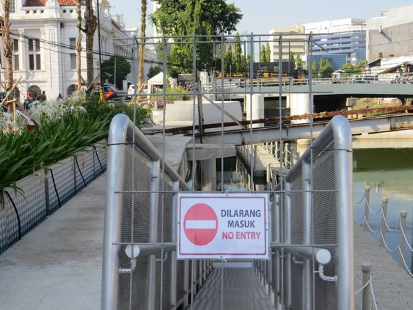 JAKARTA, INDONESIA - July 7, 2018: A sign of entry ban of Taman Apung Kali Besar, Kota Tua.