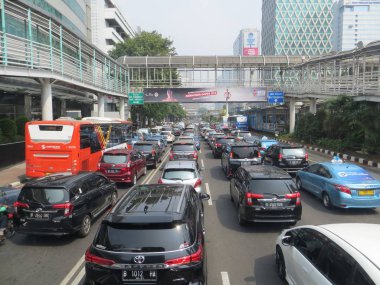 JAKARTA, INDONESIA - August 2, 2018: Traffic on Jalan Thamrin around Bundaran Bank Indonesia (Bank Indonesia Roundabout).