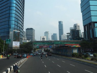 JAKARTA, INDONESIA - August 24, 2018: Traffic on Jalan Sudirman (Sudirman road).